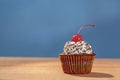Cupcake with red cherry on top Royalty Free Stock Photo