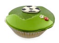 Cupcake with soccer bal isolated over white