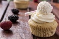 Cupcake with strawberries on brown table Royalty Free Stock Photo