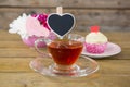 Cupcake, tea, flower vase and happy mothers day greetings card in tray Royalty Free Stock Photo