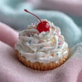 Cupcake topped with whipped cream, sprinkles, and cherry. Royalty Free Stock Photo