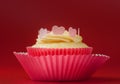 Nice vanilla cupcake with icing and eatable hearts Royalty Free Stock Photo