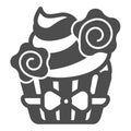 Cupcake with whipped cream and flower deco with bow solid icon, pastry concept, muffin vector sign on white background Royalty Free Stock Photo