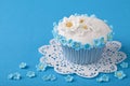 Cupcake with white and blue flowers