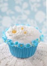 Cupcake with white and blue flowers Royalty Free Stock Photo