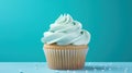 a cupcake with white frosting on a blue surface. generative ai