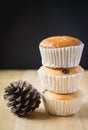 Cupcake on wood and black background