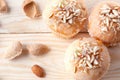 Cupcakes with almond crumbs on a light wooden table