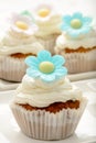 Cupcakes with buttercream decorated with flowers.