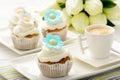 Cupcakes with buttercream decorated with flowers.