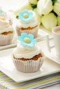 Cupcakes with buttercream decorated with flowers.