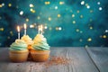 Cupcakes with candles on the table. Beautiful lights at background. Happy birthday, party, holiday mood. AI Generated Royalty Free Stock Photo