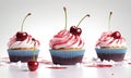 Cupcakes with cherry on top, isolated on white background. Royalty Free Stock Photo