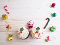 Cupcakes with christmas shape and ornament decoration on wooden