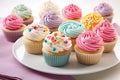 Cupcakes with colorful frosting on white plate, closeup, Delight in a collection of beautifully crafted cup, AI Generated