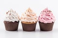 Cupcakes with colorful whipped cream on white background