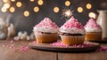 cupcakes with cream a festive cupcake with white frosting and pink sprinkles and a sparkler on a wooden table