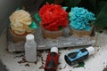 Cupcakes with cream flowers and colorants macro Royalty Free Stock Photo