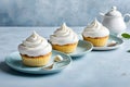 Cupcakes with creamy icing on a blue background. Template for displaying product presentation. Artificial Intelligence