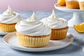 Cupcakes with creamy icing on a blue background. Template for displaying product presentation. Artificial Intelligence