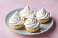 Cupcakes with creamy icing on a pink background. Template for displaying product presentation. Artificial Intelligence