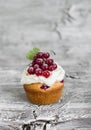 Cupcakes with curd cream and red currants