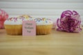 Cupcakes with flowers and a happy mothers day note Royalty Free Stock Photo