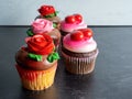 5 Cupcakes With Frosting And Hearts And Roses