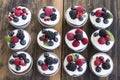 Cupcakes with Fruits on a Rustic Wooden Table