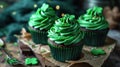 Cupcakes with green cream and filling and shamrock on top