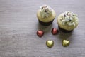 A cupcakes with heart shape chocolate on wooden table Royalty Free Stock Photo