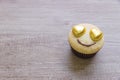 A cupcakes with heart shape chocolate on wooden table Royalty Free Stock Photo