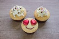 A cupcakes with heart shape chocolate on wooden table