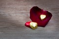 A cupcakes with heart shape chocolate on wooden table