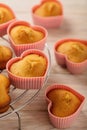 Cupcakes hearts in silicone forms of pink color.