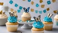 cupcakes with icing Cupcakes with cream and sugar butterflies and birthday candles on a white plate. Royalty Free Stock Photo