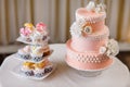 Cupcakes with individual wedding decoration with wedding cake