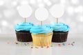 Cupcakes Mockup with Three Blue Frosted Cupcakes