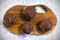 Cupcakes or muffins covered with chocolate cream