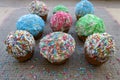 Cupcakes with multi colored sugar sprinkles on the table Royalty Free Stock Photo