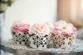 Cupcakes on plate on buffet table. Colorful beautiful cupcakes with cream Royalty Free Stock Photo