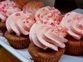 cupcakes with summer berries. Dessert buffet or candy bar during catering event.Muffins with pink fruit cream. Close-up Royalty Free Stock Photo