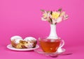 Cupcakes, tea and flowers in a vase Royalty Free Stock Photo