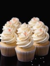 Cupcakes with whipped cream frosting.