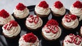 30th birthday cupcakes with white frosting and red sprinkles on a black plate. The cupcakes have numbers 3 three 0 zero thirty 30