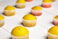 Cupcakes on white background. Muffins on wooden table, closeup. Homemade bakery