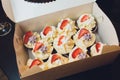 cupcakes in a white box, delivery of cupcakes, cupcakes with fresh red currant, close-up photo of cupcakes. Royalty Free Stock Photo
