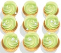 Cupcakes on a white table. Summer delicious desserts greenery color