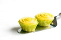Cupcakes with yellow cream on cake shovel Royalty Free Stock Photo