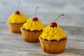 Cupcakes with yellow frosting. Royalty Free Stock Photo